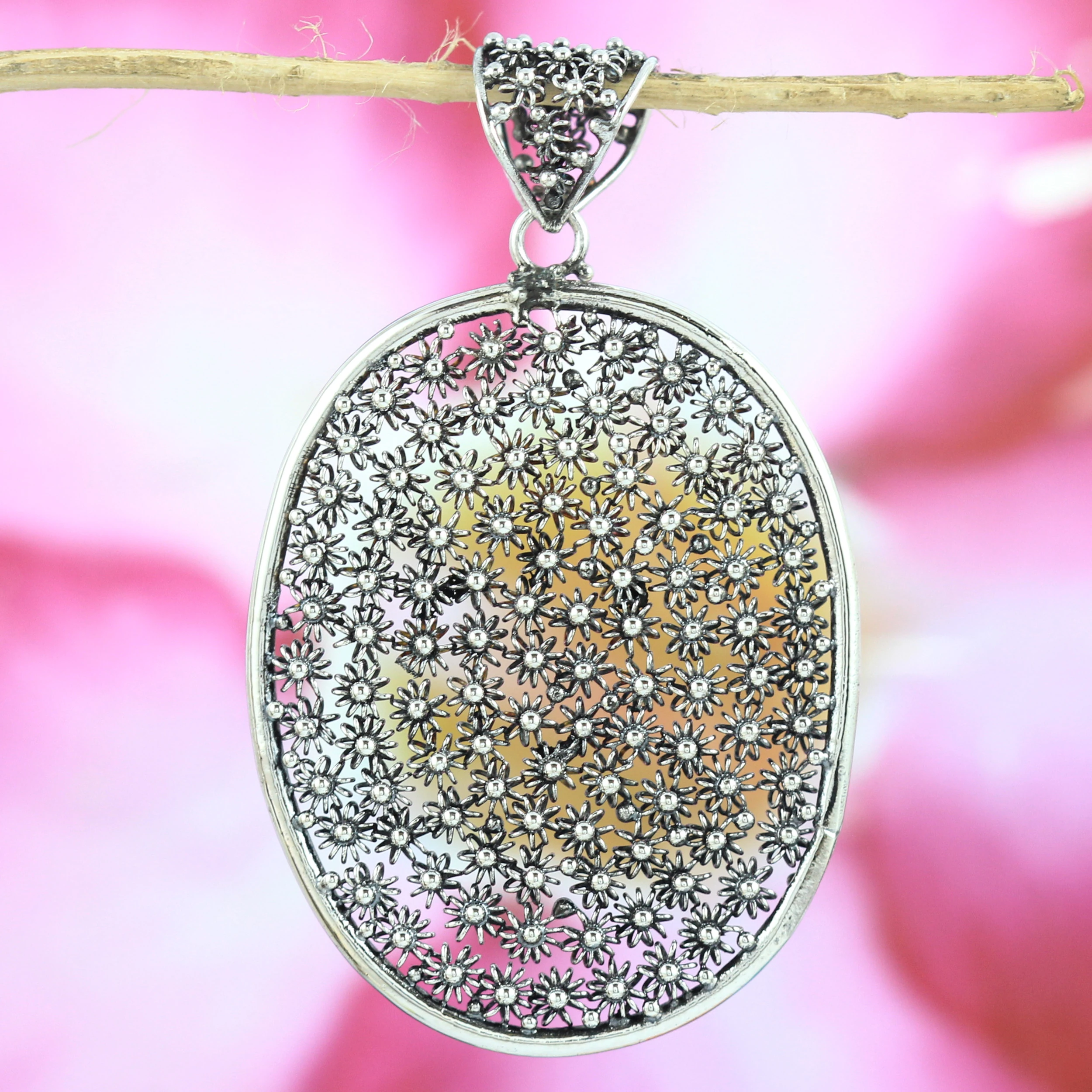 Oval Silver Pendant with Classic Balinese Floral Scatter Motif P497W415